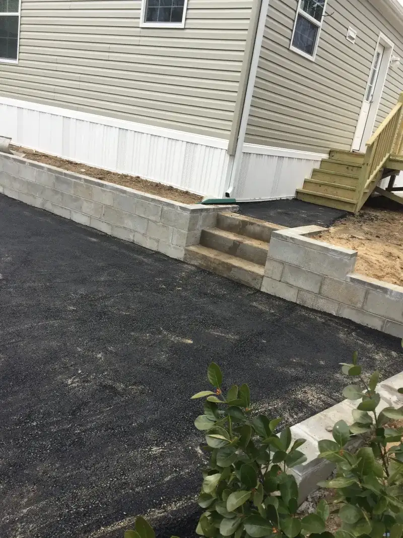 Asphalt Side Yard and Retaining Wall Repair - After
