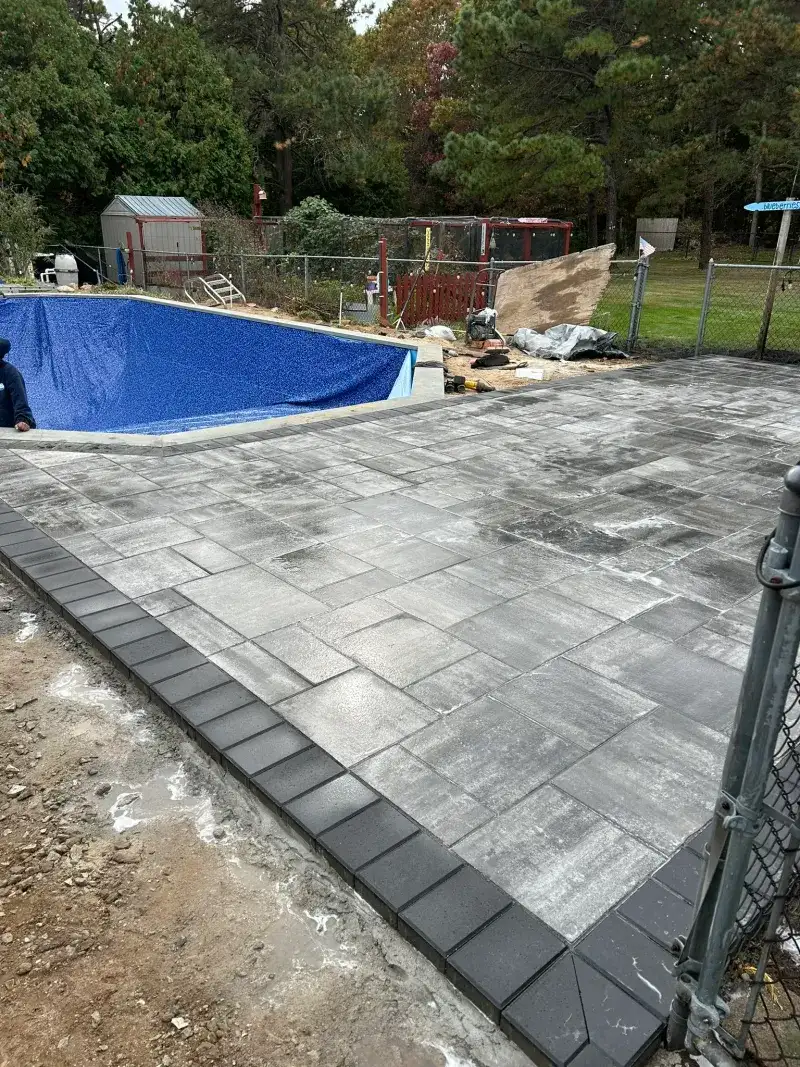 Gray Paver Pool-Deck Installation: gray paver pool deck installation view one